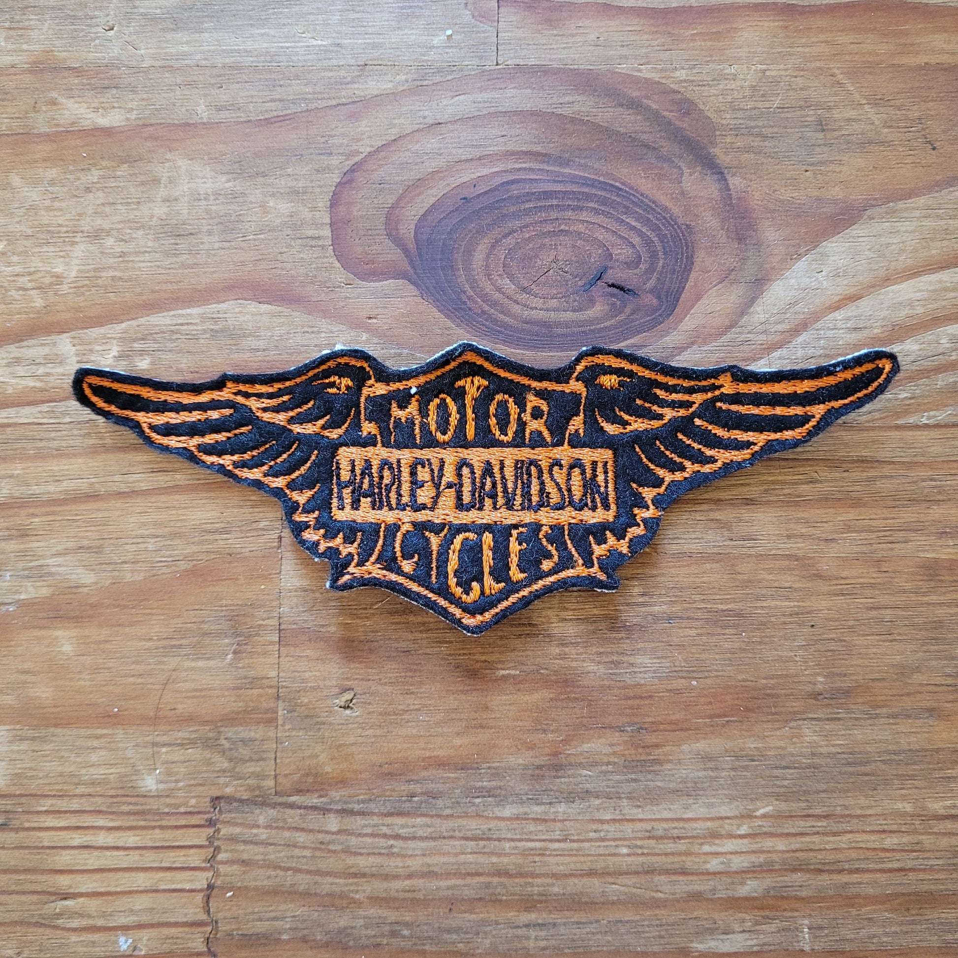 Vintage Harley Wing Logo ( Version Black & Orange) - L'Insoumis Clothing